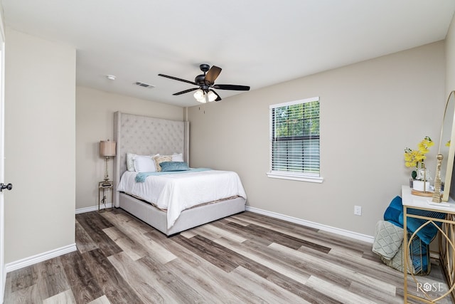 bedroom featuring hardwood / wood-style flooring and ceiling fan