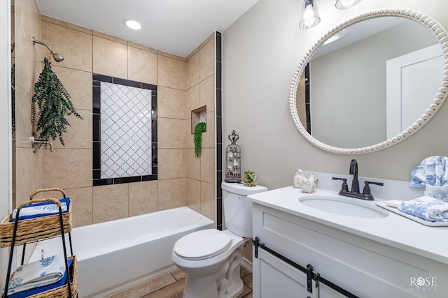 full bathroom with hardwood / wood-style flooring, vanity, toilet, and tiled shower / bath combo