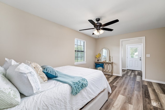 bedroom featuring hardwood / wood-style flooring and ceiling fan