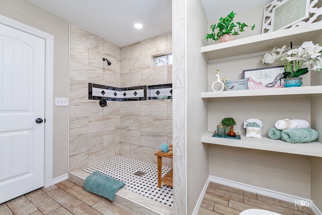 bathroom featuring a tile shower