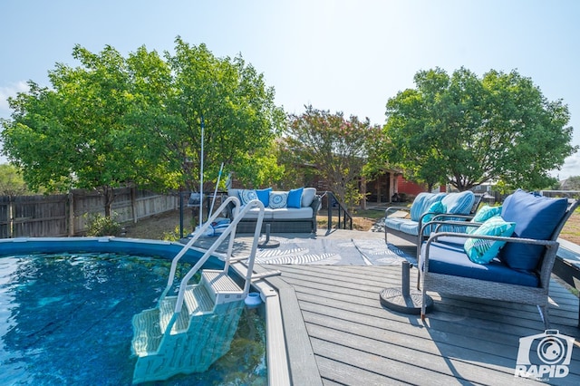 view of swimming pool featuring an outdoor living space