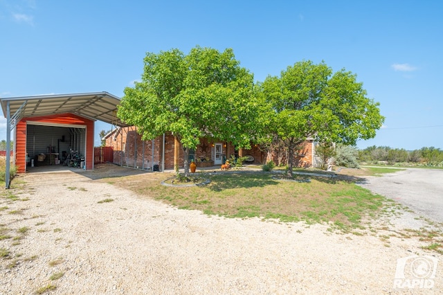 view of front facade featuring a garage and a carport