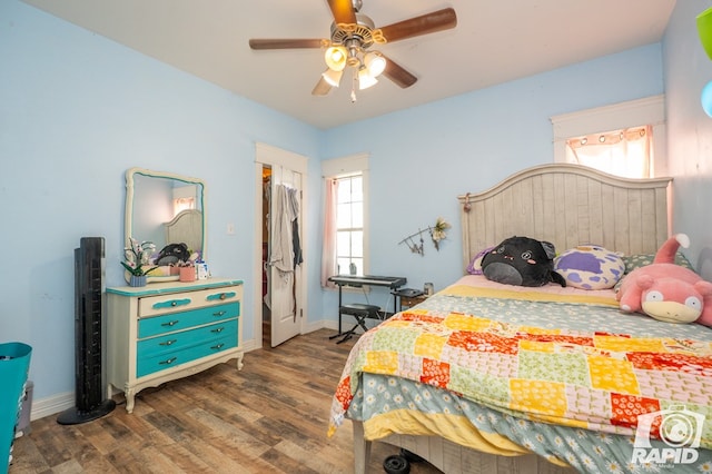 bedroom featuring dark hardwood / wood-style floors and ceiling fan