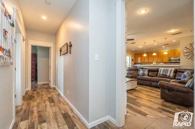 hall featuring light wood-type flooring