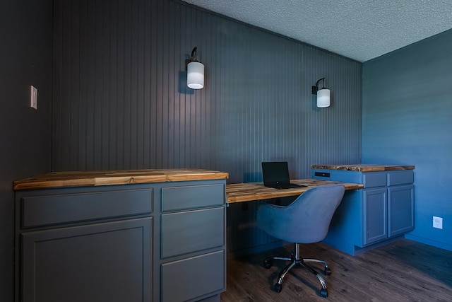 office space featuring wood-type flooring and a textured ceiling