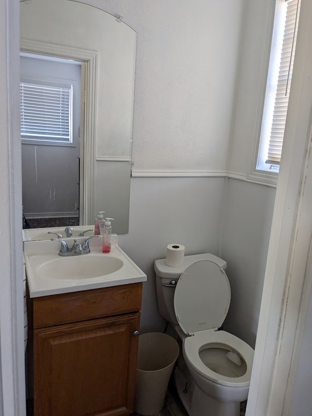 bathroom featuring vanity and toilet