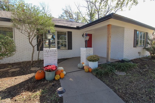 doorway to property with a patio area