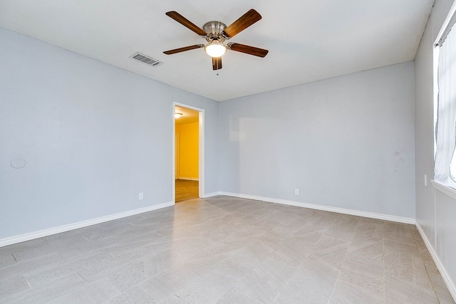 spare room with ceiling fan