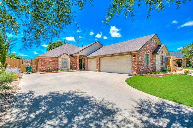6023 Warwick Dr, San Angelo, TX 76904 - ranch-style home with brick siding, an attached garage, driveway, and a shingled roof
