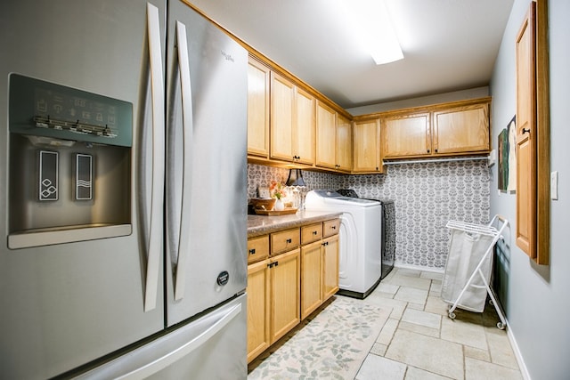 6023 Warwick Dr, San Angelo, TX 76904 - laundry area featuring separate washer and dryer and baseboards