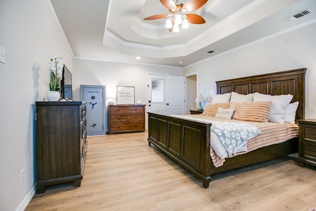 6023 Warwick Dr, San Angelo, TX 76904 - bedroom featuring a raised ceiling, light wood finished floors, crown molding, a ceiling fan, and recessed lighting
