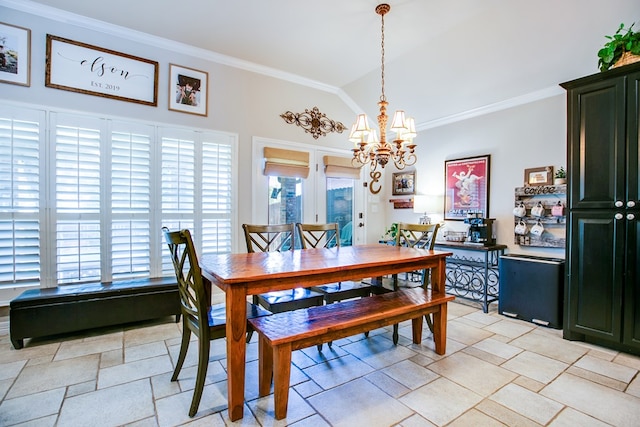 6023 Warwick Dr, San Angelo, TX 76904 - dining area with stone tile floors, a chandelier, ornamental molding, and vaulted ceiling