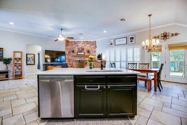 6023 Warwick Dr, San Angelo, TX 76904 - kitchen with stainless steel dishwasher, ceiling fan, light countertops, a chandelier, and arched walkways