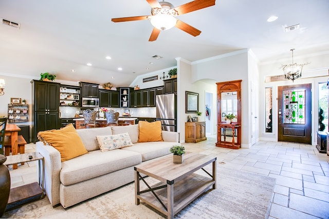 6023 Warwick Dr, San Angelo, TX 76904 - living room with a chandelier, ornamental molding, arched walkways, stone tile flooring, and a ceiling fan