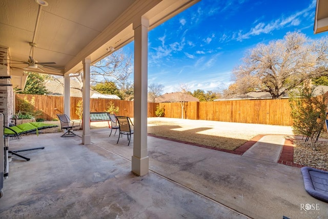 view of patio / terrace with a fenced backyard and a ceiling fan