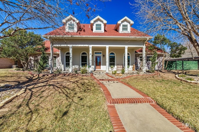 view of front of house with a front lawn and a porch