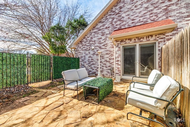 view of patio / terrace featuring an outdoor hangout area and fence