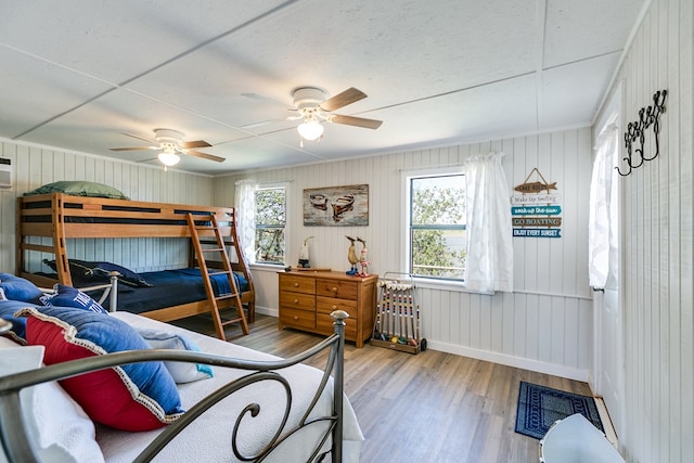 bedroom with hardwood / wood-style flooring and ceiling fan