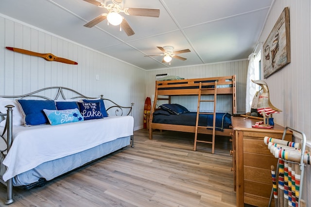 bedroom with ceiling fan and light wood-type flooring