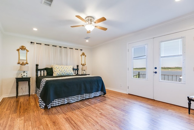 bedroom with french doors, ceiling fan, crown molding, and hardwood / wood-style floors