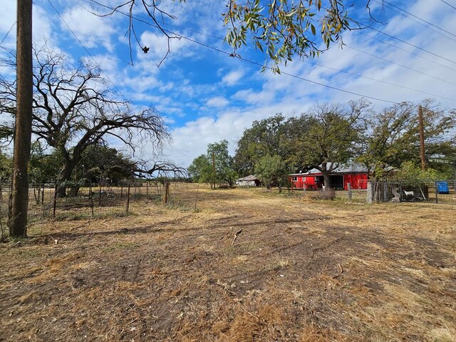 view of yard with a rural view