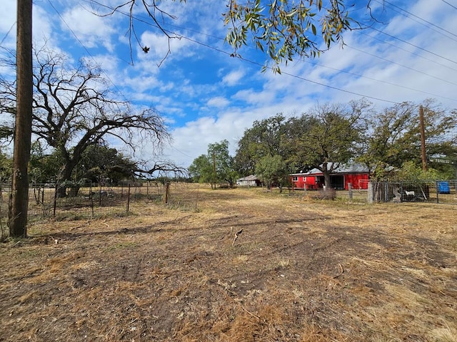 view of yard with a rural view