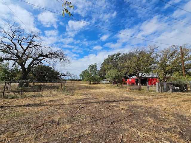 view of yard with a rural view