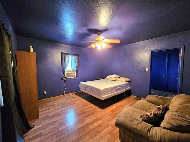 bedroom with hardwood / wood-style flooring and ceiling fan