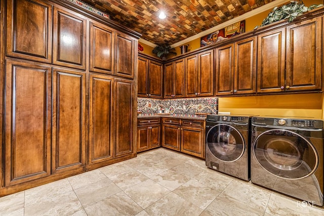 washroom featuring cabinets, crown molding, separate washer and dryer, and brick ceiling