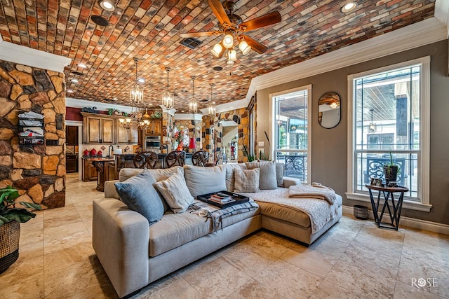 living room featuring ceiling fan and ornamental molding