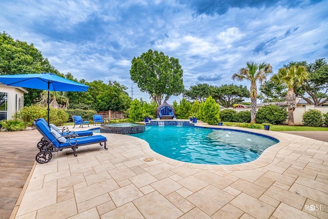 view of swimming pool featuring a patio, an in ground hot tub, and pool water feature