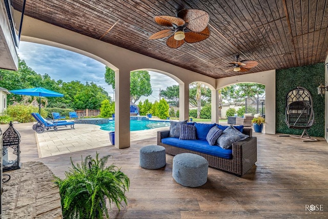 view of patio / terrace with ceiling fan and outdoor lounge area