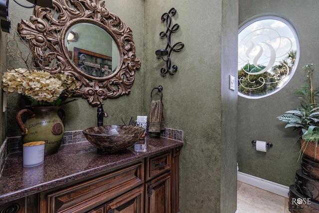 bathroom featuring vanity and tile patterned flooring