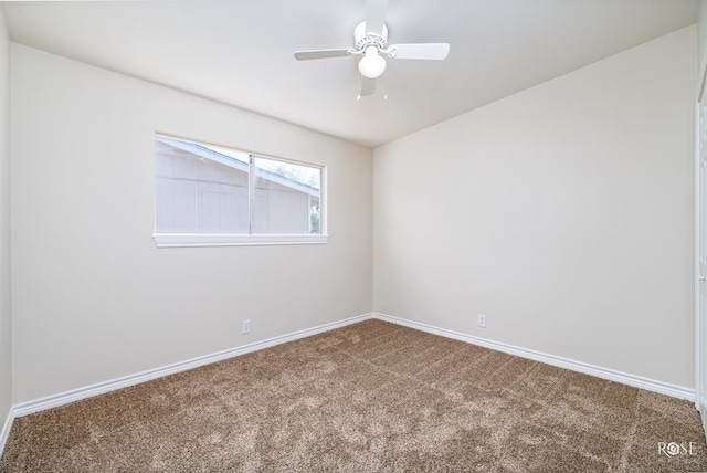 carpeted spare room with ceiling fan