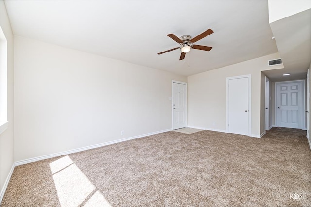 carpeted empty room with ceiling fan