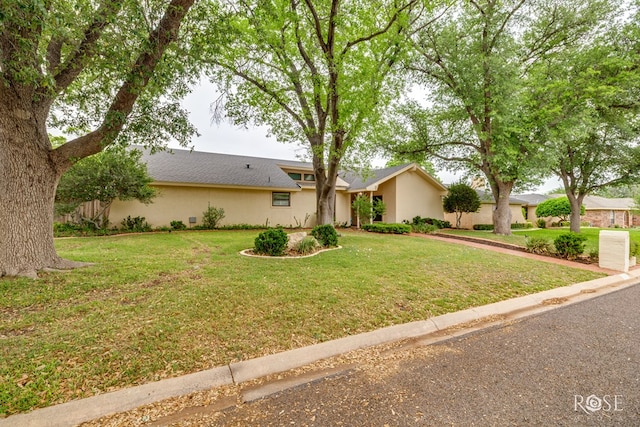 3210 Briargrove Ln, San Angelo, TX 76904 - ranch-style house featuring a front yard and stucco siding