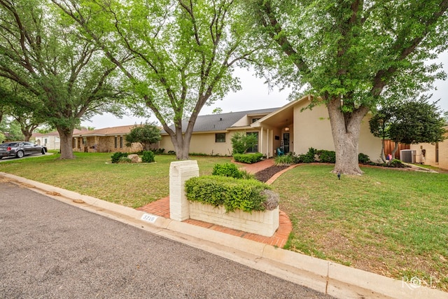 3210 Briargrove Ln, San Angelo, TX 76904 - single story home with central air condition unit, a front yard, and stucco siding