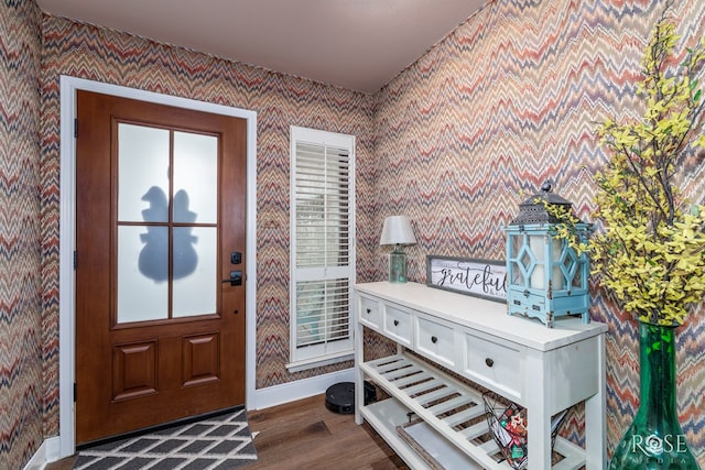 3210 Briargrove Ln, San Angelo, TX 76904 - entryway with dark wood-style flooring, wallpapered walls, and baseboards