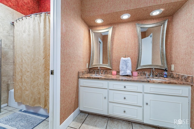 3210 Briargrove Ln, San Angelo, TX 76904 - bathroom with double vanity, tile patterned floors, a sink, and shower / bath combo with shower curtain