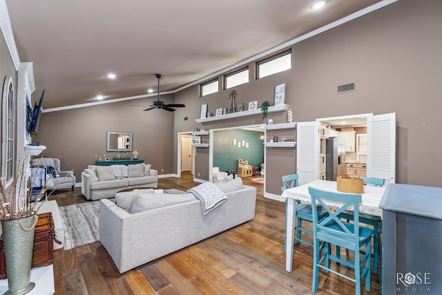 3210 Briargrove Ln, San Angelo, TX 76904 - living area featuring crown molding, a ceiling fan, wood finished floors, and visible vents