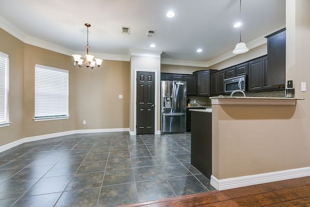 kitchen featuring light stone countertops, appliances with stainless steel finishes, ornamental molding, and kitchen peninsula