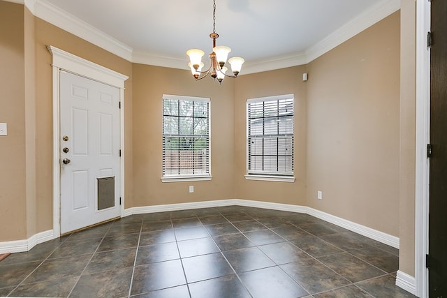 foyer featuring a notable chandelier and crown molding