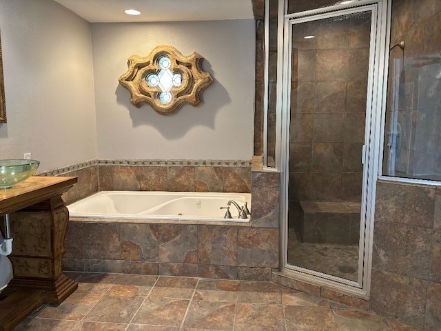 bathroom featuring vanity and separate shower and tub