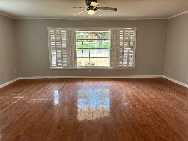 empty room with ceiling fan, ornamental molding, and dark hardwood / wood-style flooring