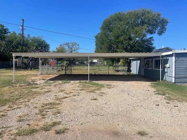 view of parking / parking lot with a carport