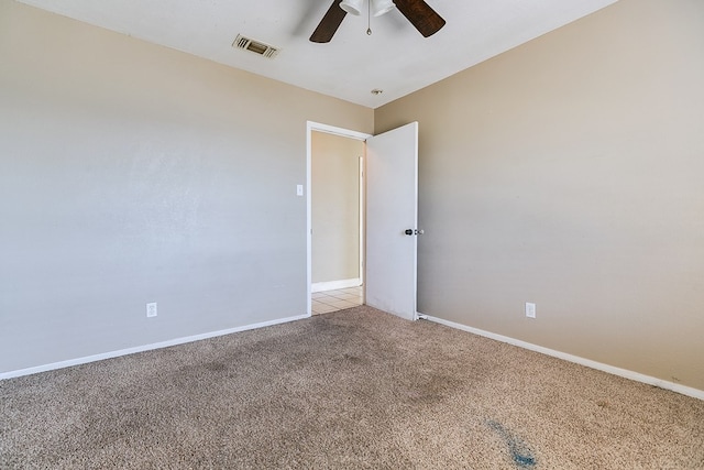 3101 Grove Dr, San Angelo, TX 76903 - empty room featuring a ceiling fan, light carpet, and baseboards