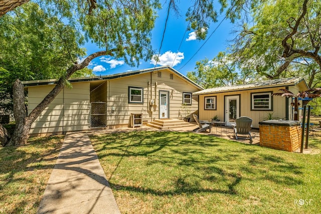 exterior space with a yard and a patio area