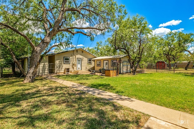 back of property featuring a lawn