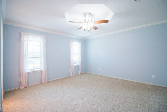 carpeted empty room with crown molding and a healthy amount of sunlight