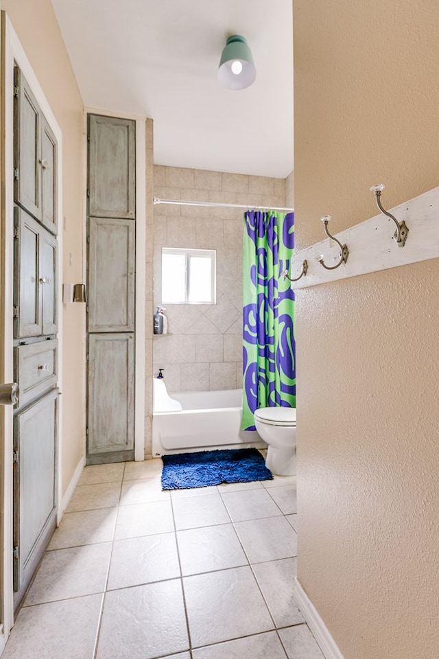 6376 Fm 380, San Angelo, TX 76905 - bathroom featuring tile patterned floors, toilet, shower / bath combination with curtain, baseboards, and a textured wall